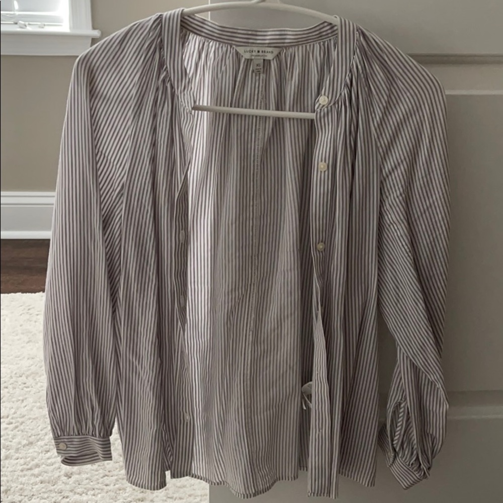 grey and white button down shirt